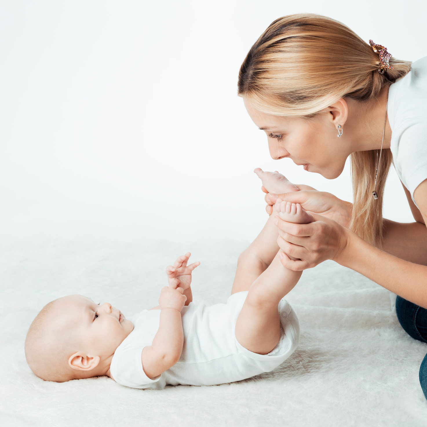 Baby with mum is making massage