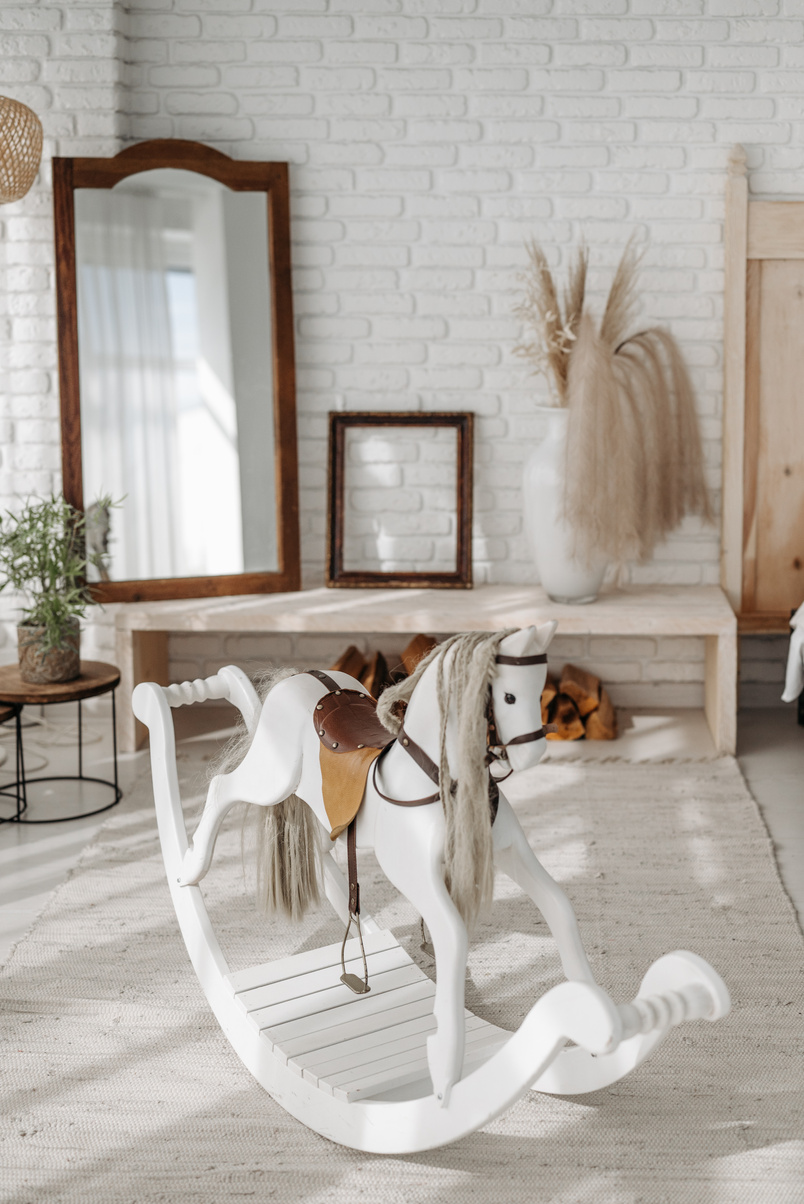 A Rocking Horse Beside the Mirror